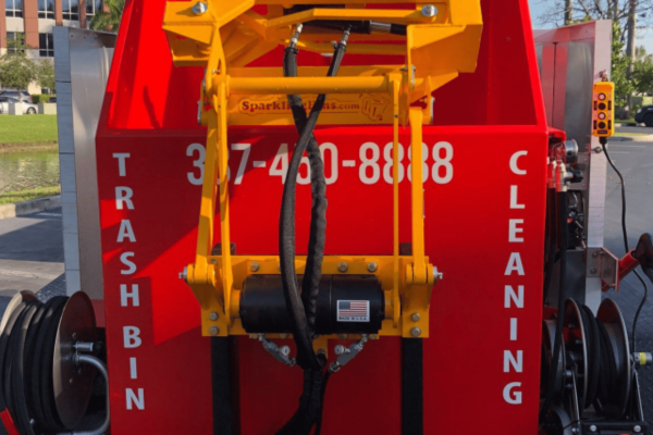 Rear view of professional trash bin cleaning truck with hydraulic lift system
